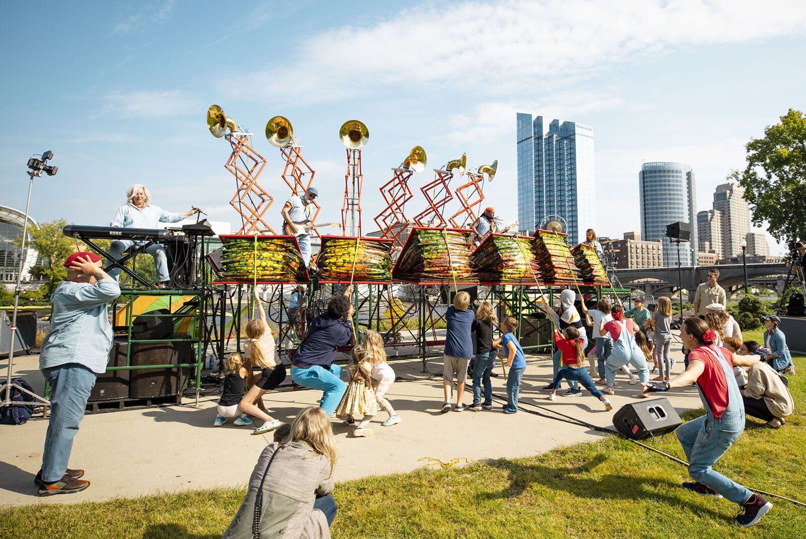 People play the Squonkcordion at a performance of "Brouhaha."