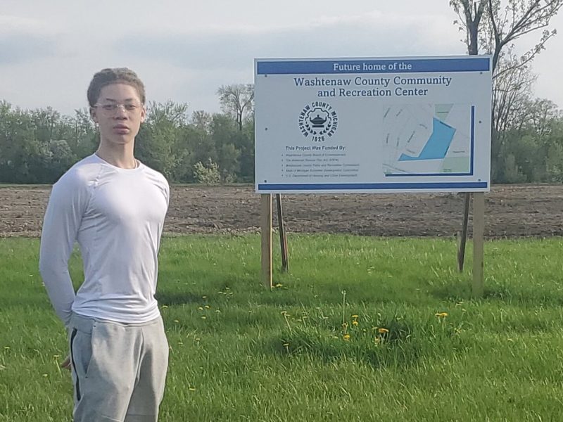 Author Jahshua Treadwell stands at the site of a future community center in Superior Township.