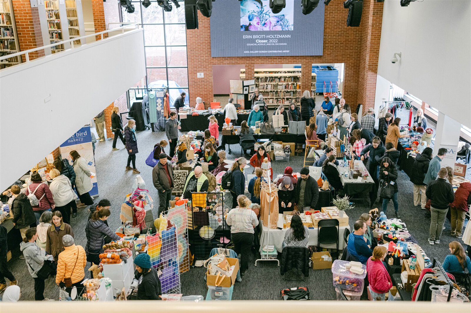 The downtown Ann Arbor District Library's lobby during the 2024 Ann Arbor Fiber Arts Expo.