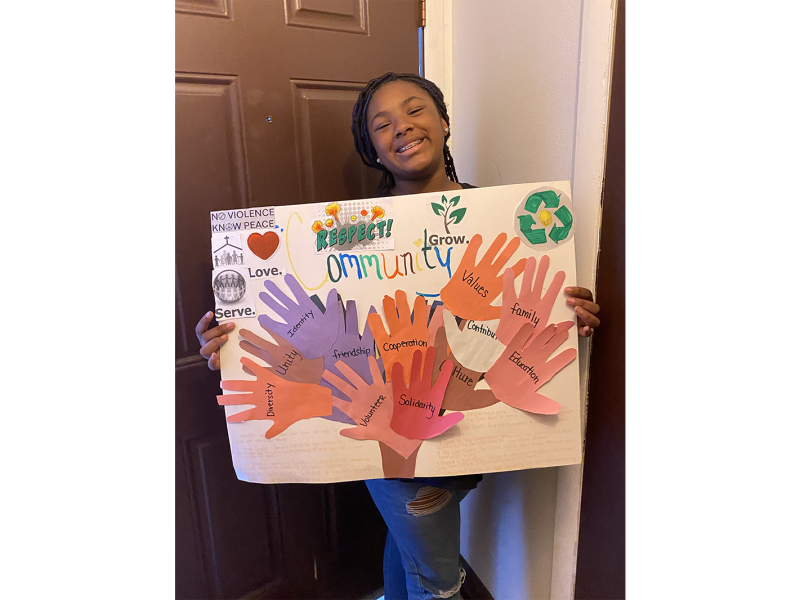 Autumn Crump holds her poster.
