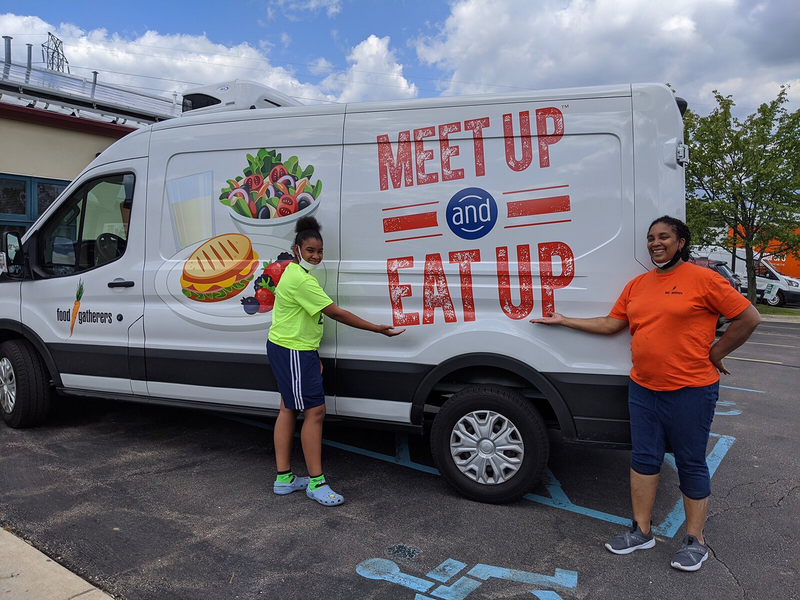 Food Gatherers staff with the van they use to deliver food to Summer Food Service Program sites.