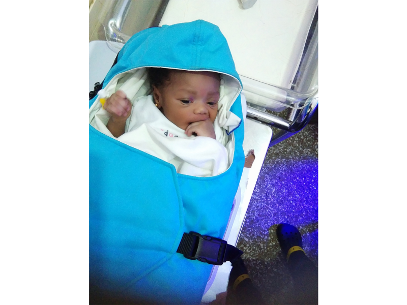 A baby in a Warmilu warming blanket.