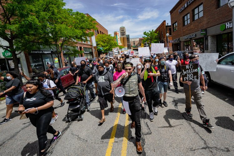 Protestors march through downtown Ann Arbor.