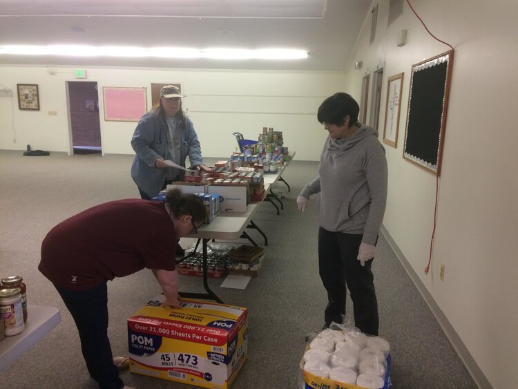 Volunteers at the Ypsilanti Friends Church prepare food for distribution.