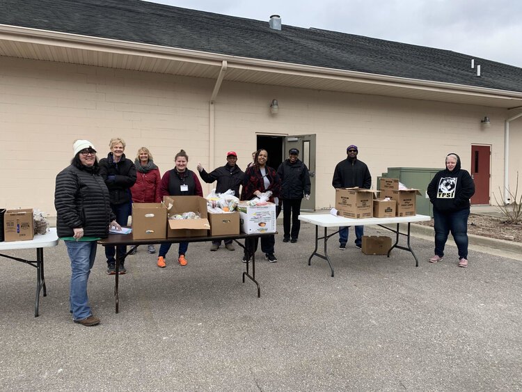 Volunteers are distributing meals to YCS families.