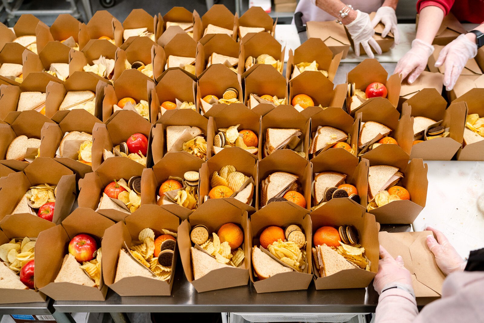 School lunches prepared by workers at Eat More Tea.