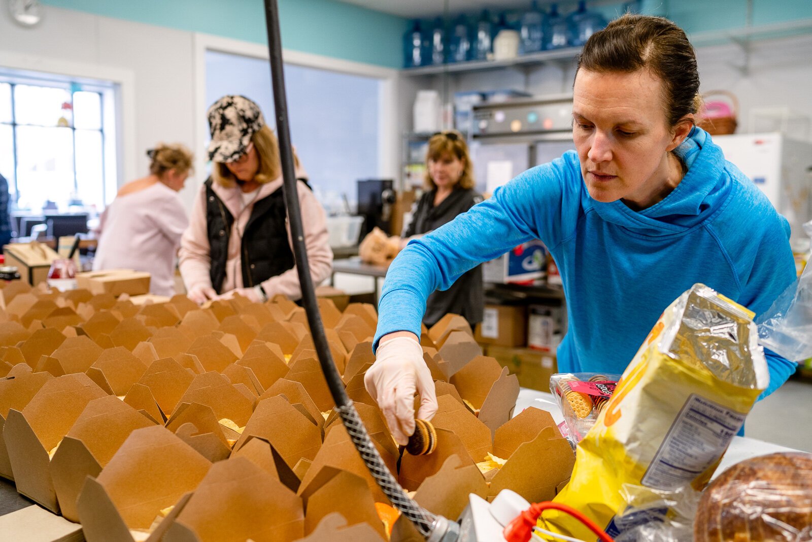 Megan Turriff prepares a school lunch at Eat More Tea.