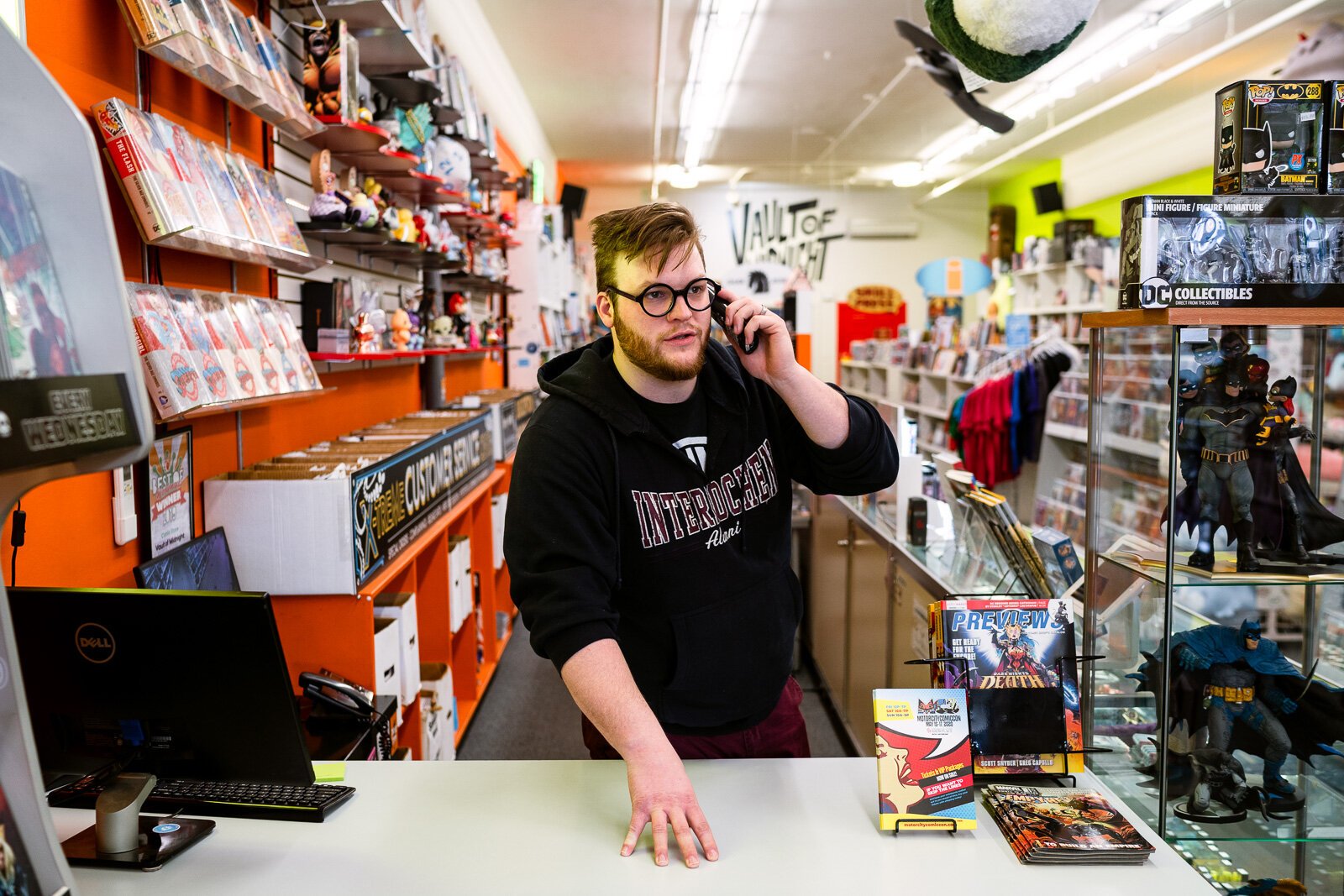 A Vault of Midnight employee takes a phone call.