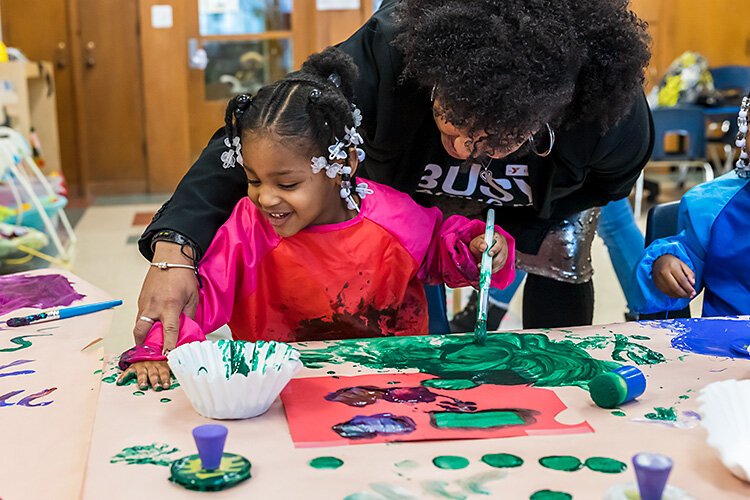 Children fingerpainting at The Collaborative.