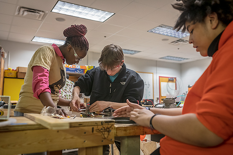 Grizzly Robotics students Ruth Ntumba, Jimmy Nagy and Xavier Delarca