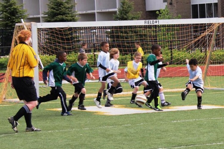 Youth play soccer at a Ferndale Parks & Rec event.