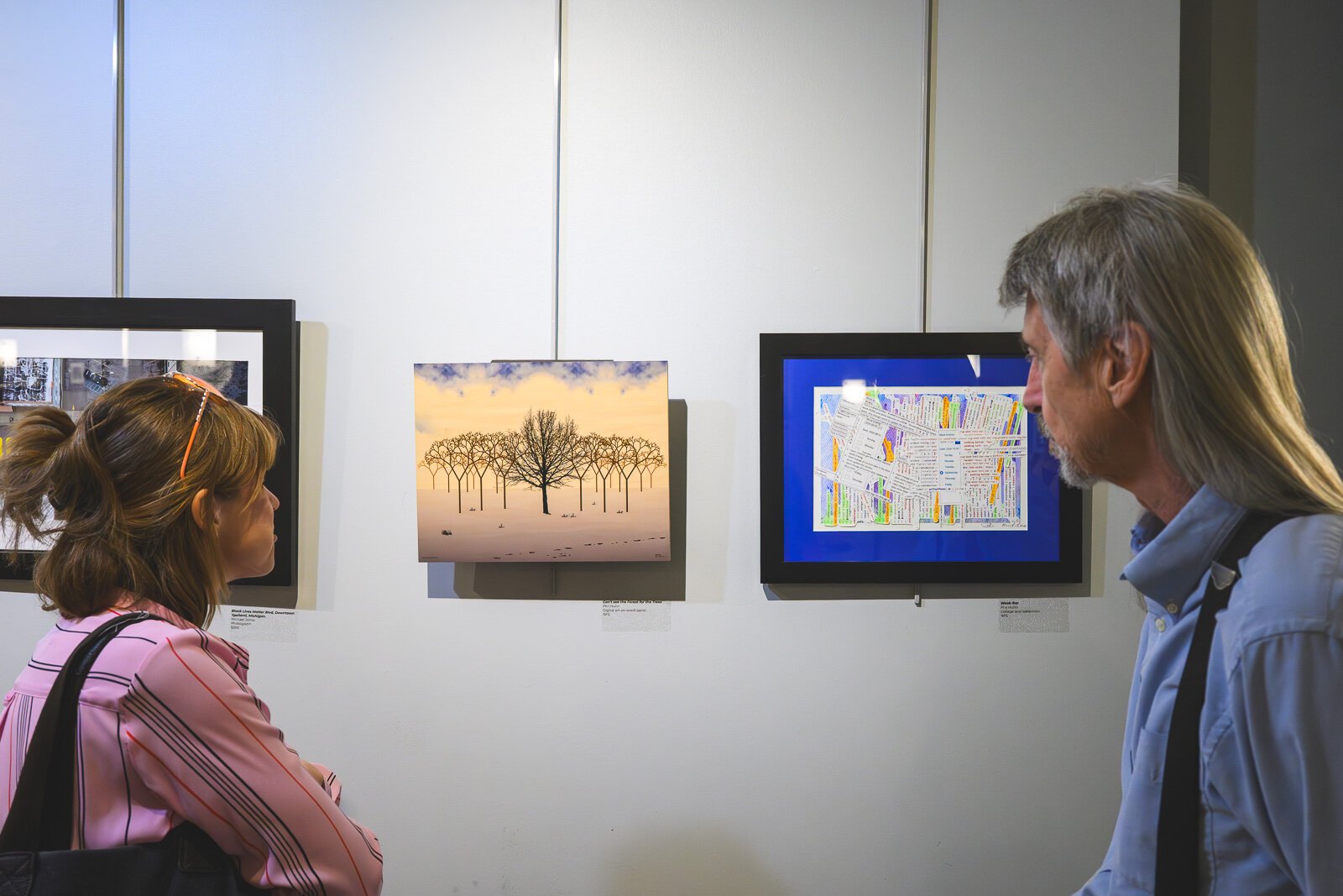 Attendees view art at "Share: An Ypsi Fine Arts Club Exhibition."