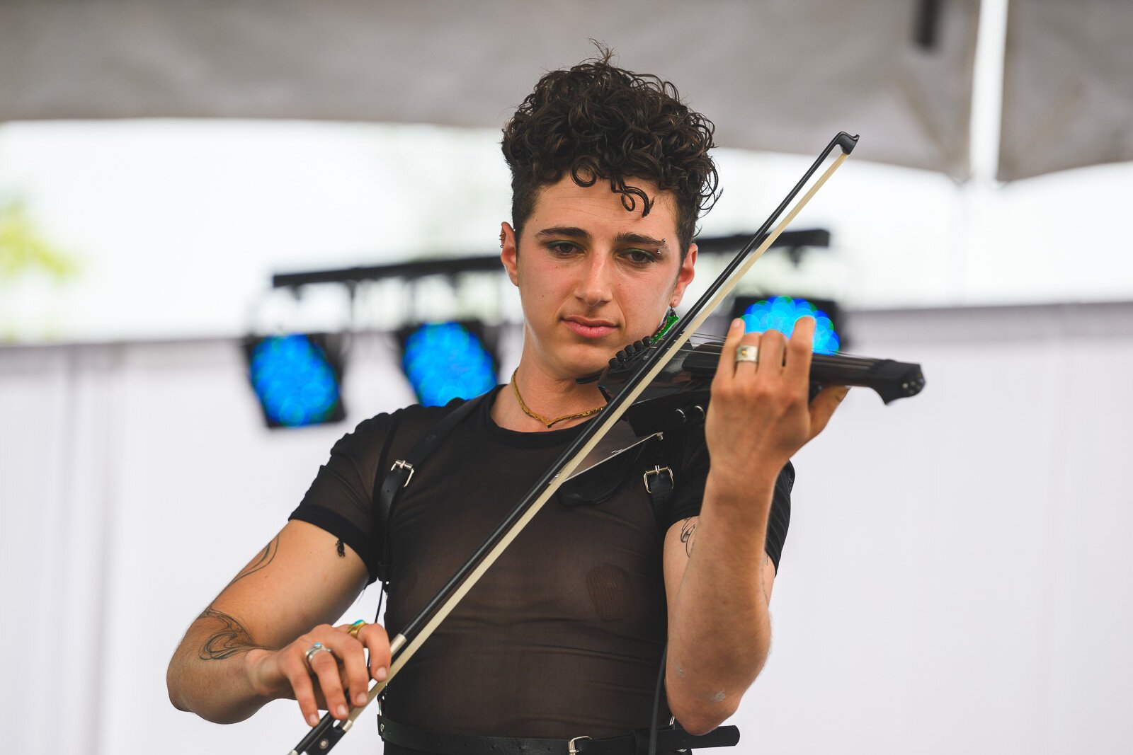 Lior of the band Premium Rat plays violin at Ypsi Pride 2025.