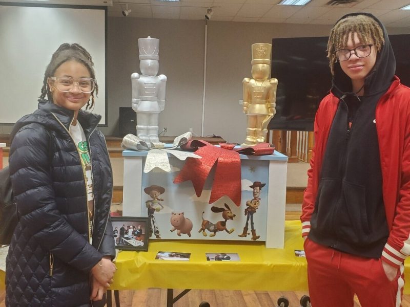 TradeScouts program participants pose with a toy box they built for a daycare center.