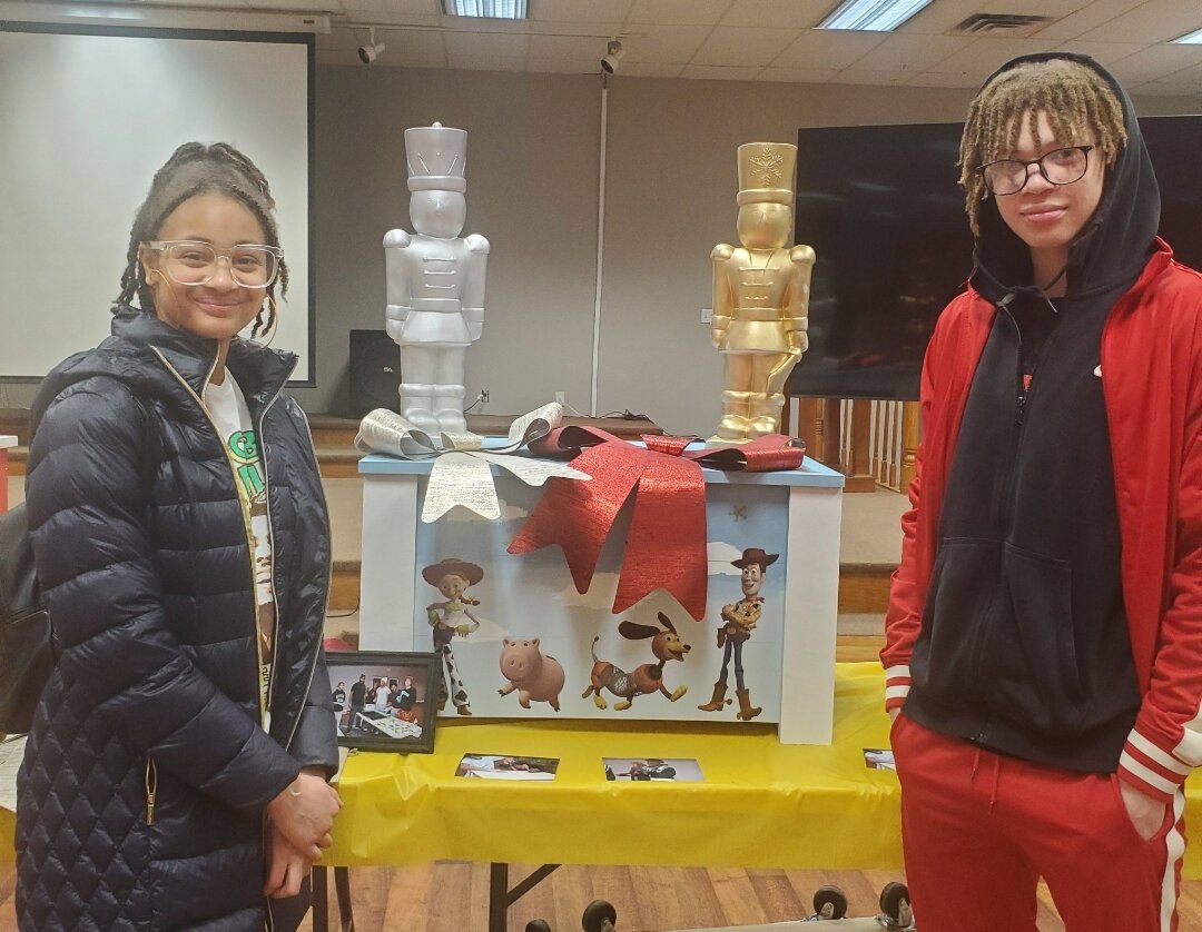 TradeScouts program participants pose with a toy box they built for a daycare center.