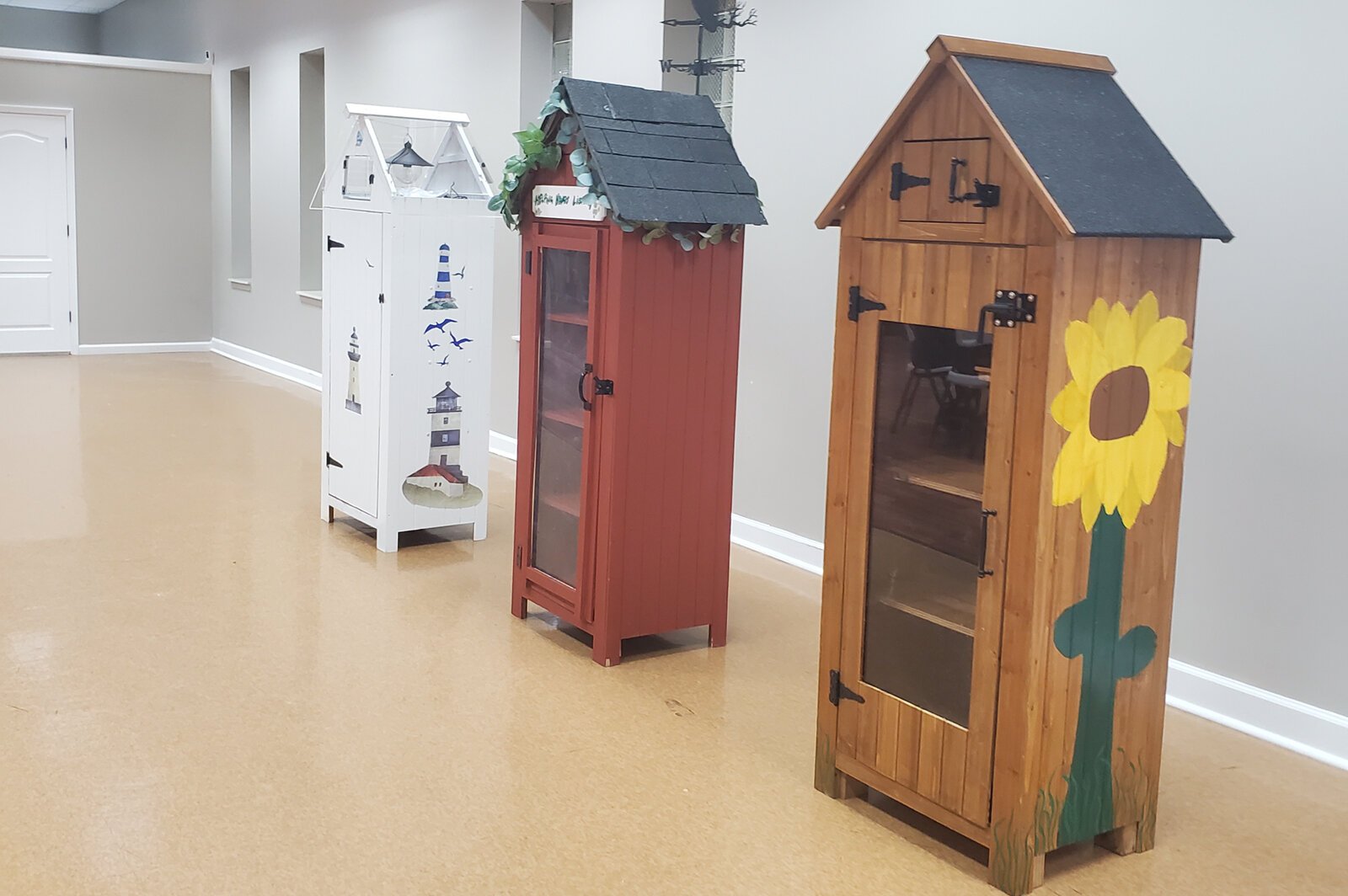 Small sheds built by TradeScouts participants to be used as Little Free Libraries or mini-food pantries.