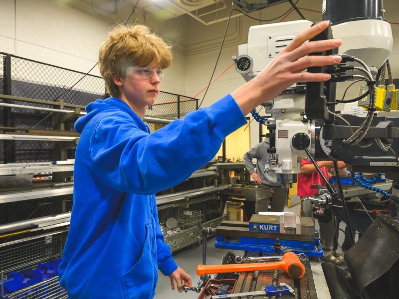 Caleb Dahl working in Computer Integrated Manufacturing class at Saline High School.