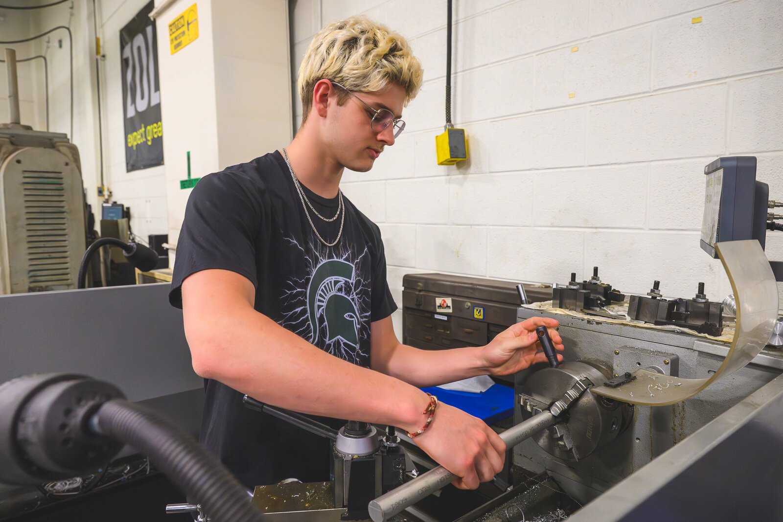 Jonah Bentley working in Computer Integrated Manufacturing class at Saline High School.