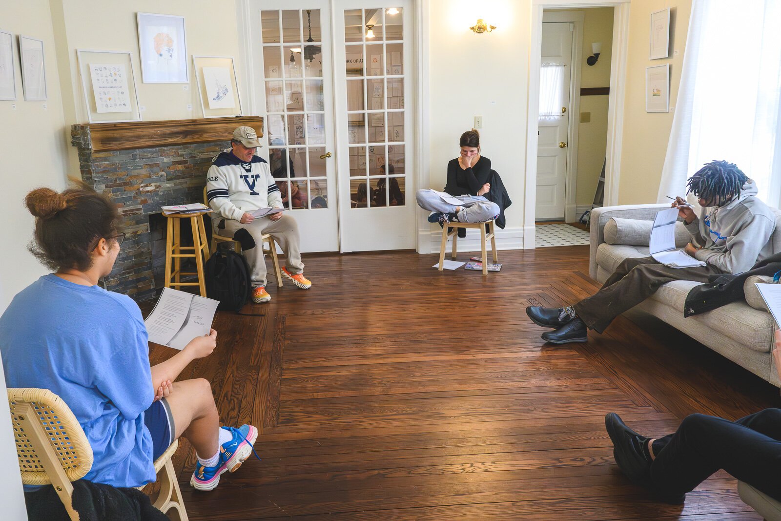 Jeff Kaas leads a poetry discussion with EmpowerED High School students .