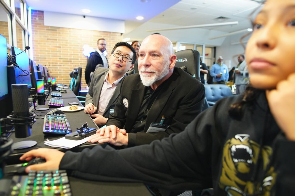 YCHS Director of Technology Solomon Zheng, YCHS Assistant Superintendent Dr. Carlos Lopez, and YCHS junior Arianna Maldonado.