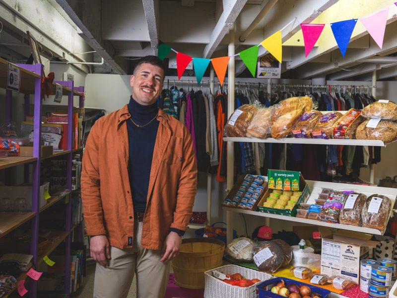 Executive Director Alex Plum at Corner Health Center's clothing closet and food pantry.