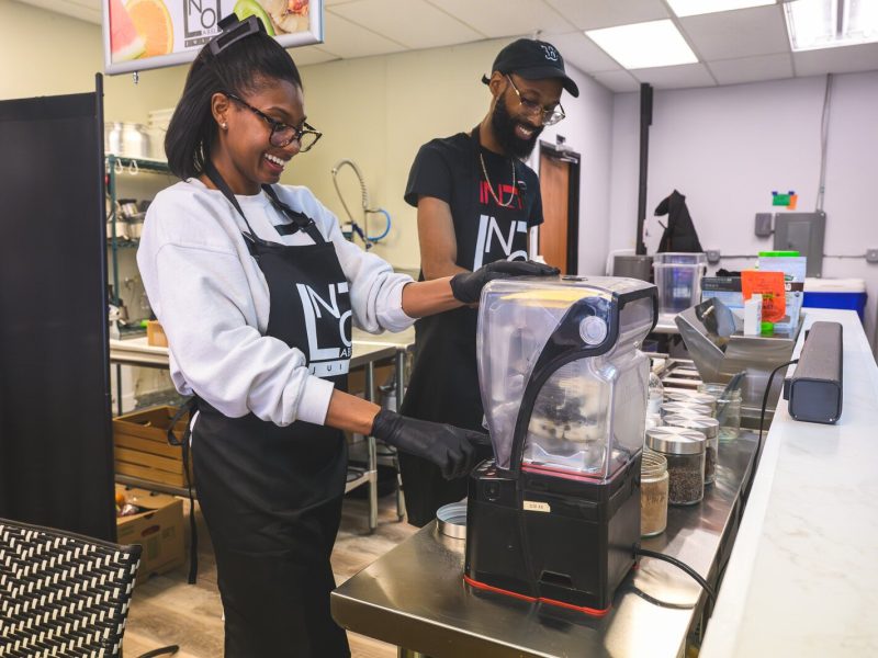Nashia and Brandon Frye preparing smoothies at No Label Juice.
