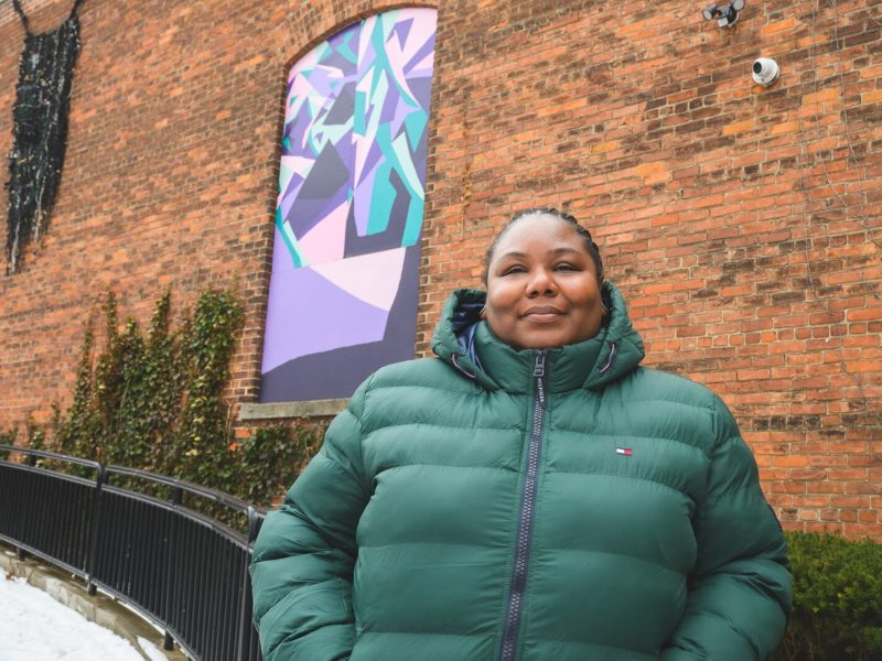 T'onna Clemons with her mural at RAC.
