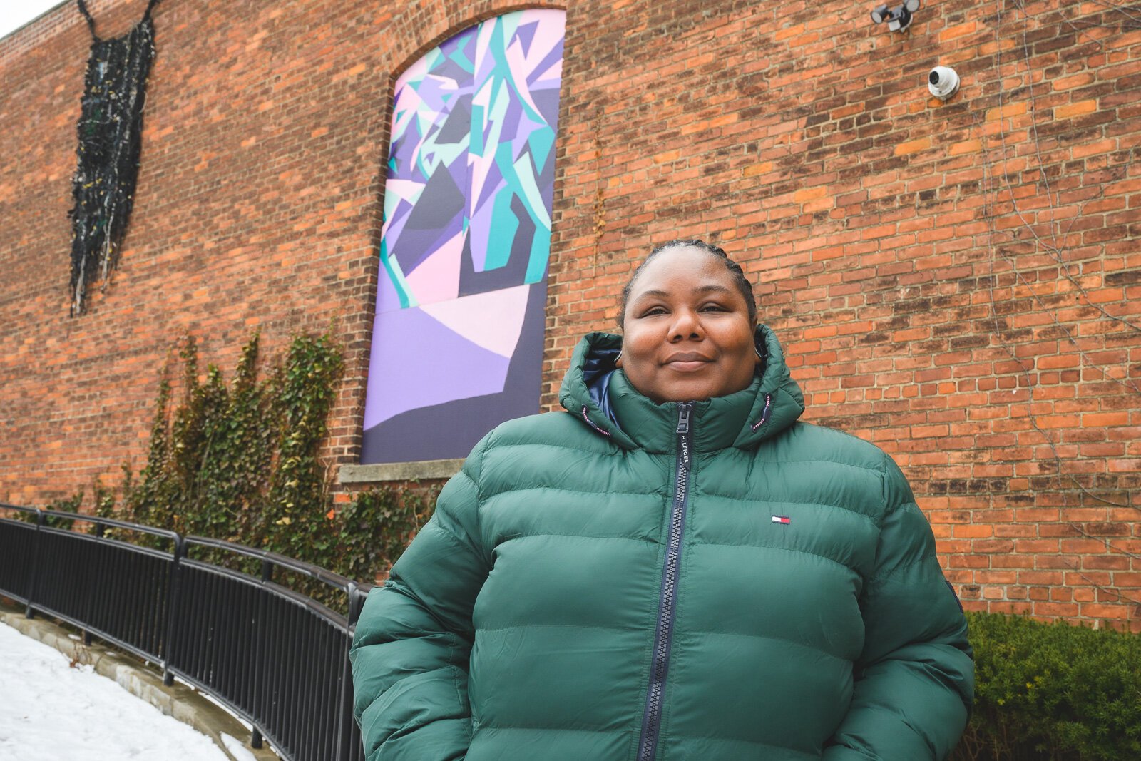 T'onna Clemons with her mural at RAC.