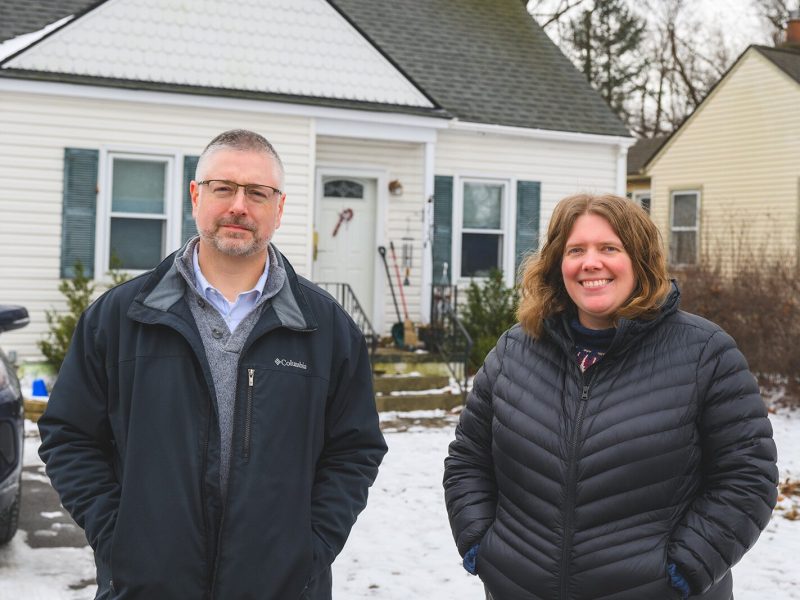 Luther Blackburn with Katelyn Zak in front of her home that had its lead service lines replaced by YCUA.