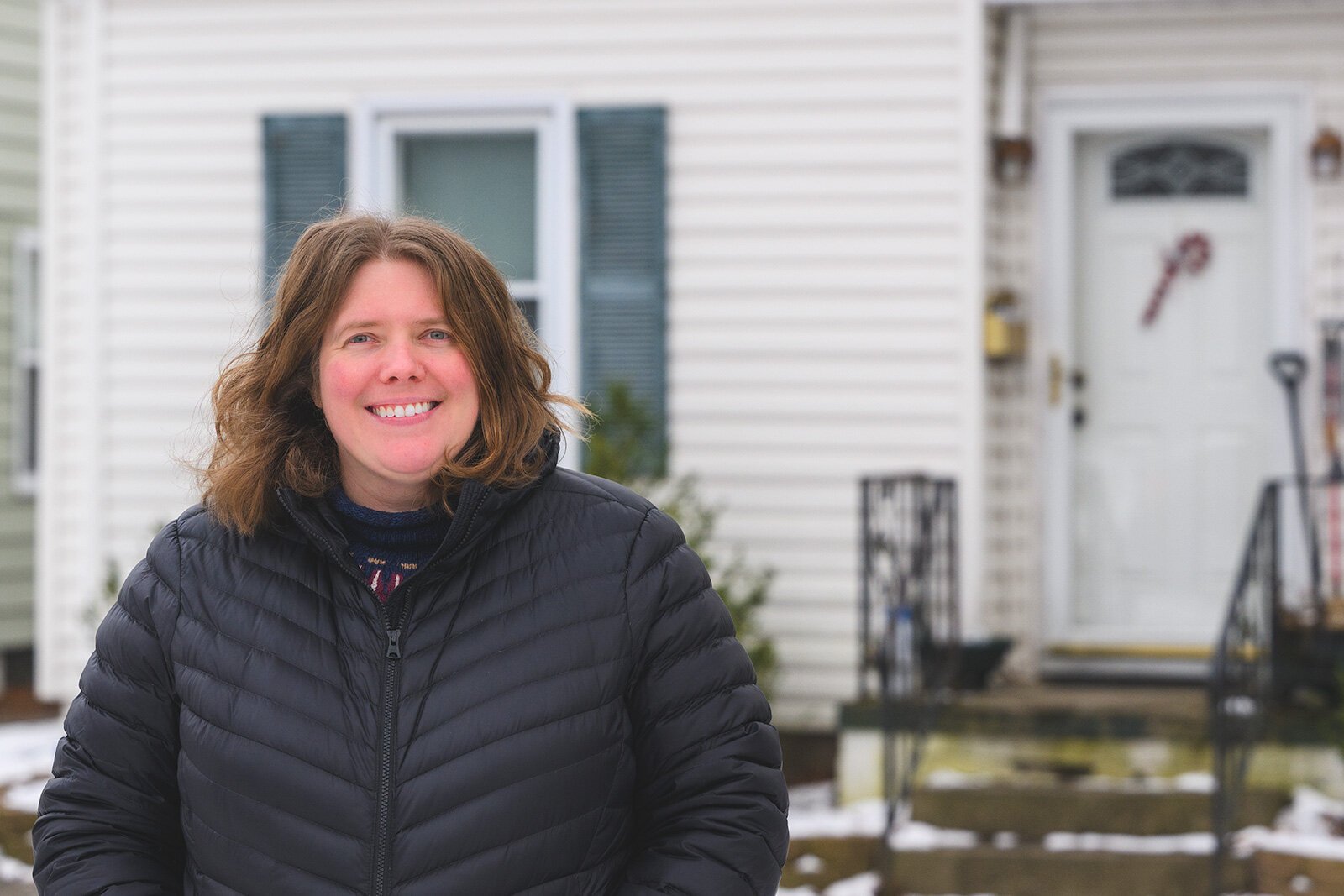 Katelyn Zak in front of her home that had its lead service lines replaced by YCUA.