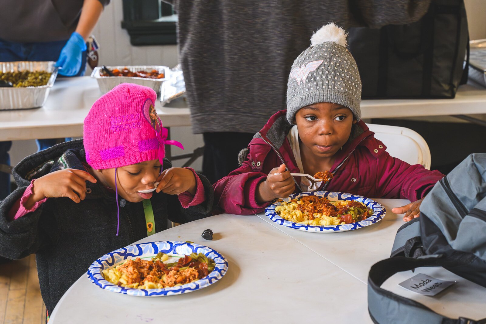 Saprina Morris' children having lunch at the Ypsilanti Freighthouse daytime warming center.