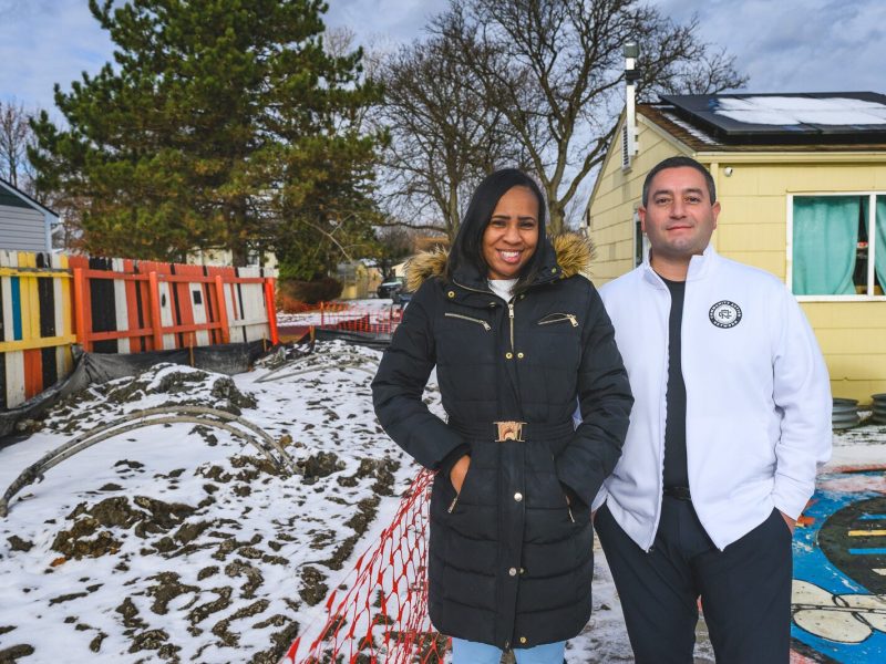 Krystal Steward and Derrick Miller by the excavation for Bryant Community Center's geothermal installation.