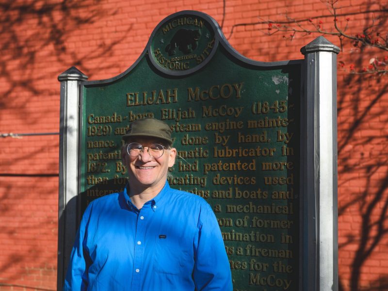 Dave Strenski in front of the Elijah McCoy plaque in Library Park.