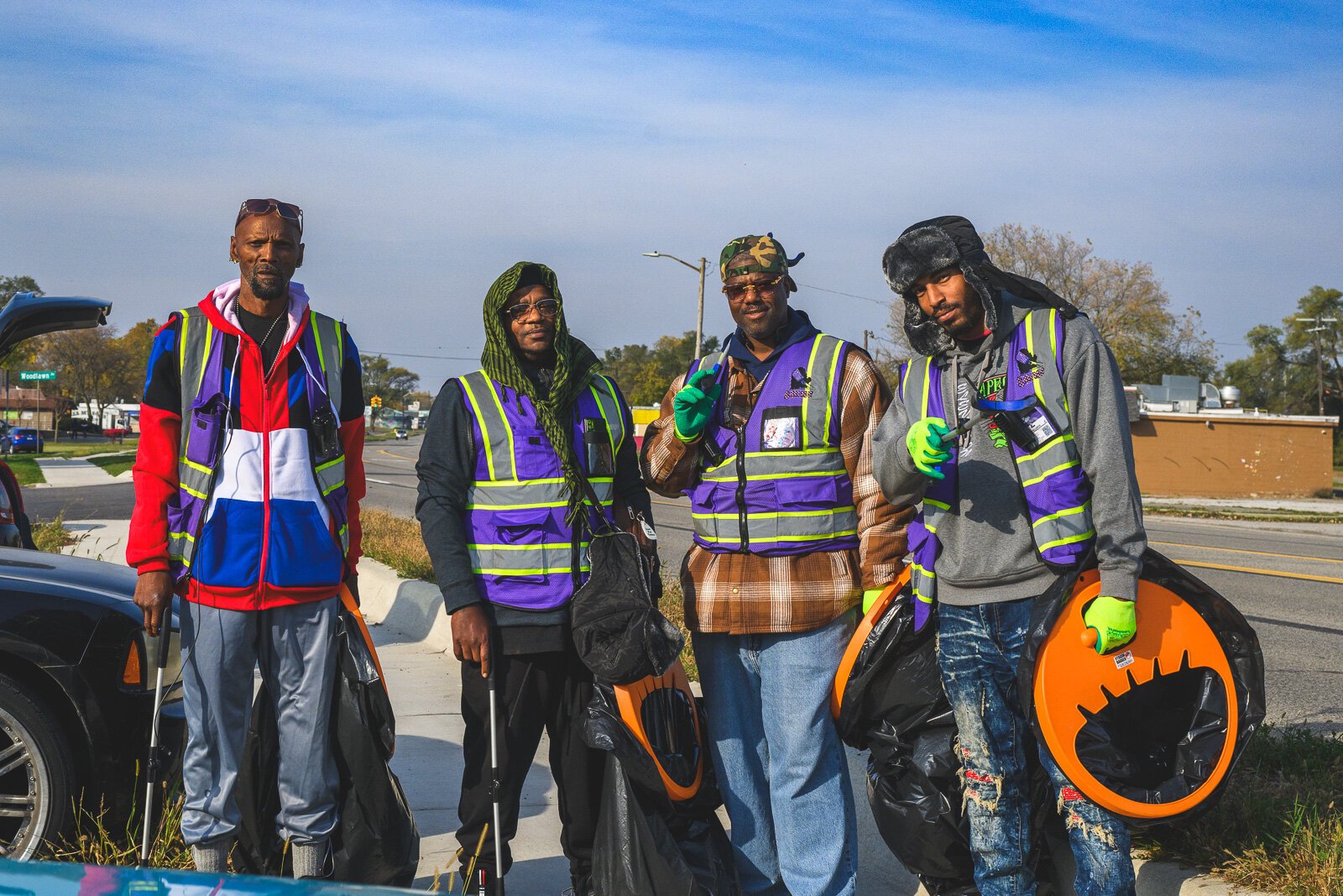 SHINE team members Willie Percy, Louis Printup, Leroy Harris and Eric Martin cleaning on Ecorse Road.