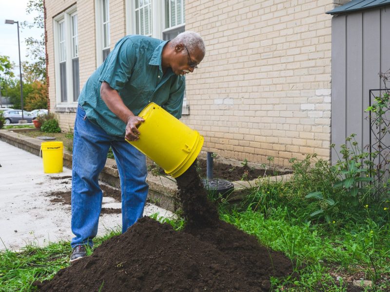 Roger Smith working on the gardens at Cross Street Village.