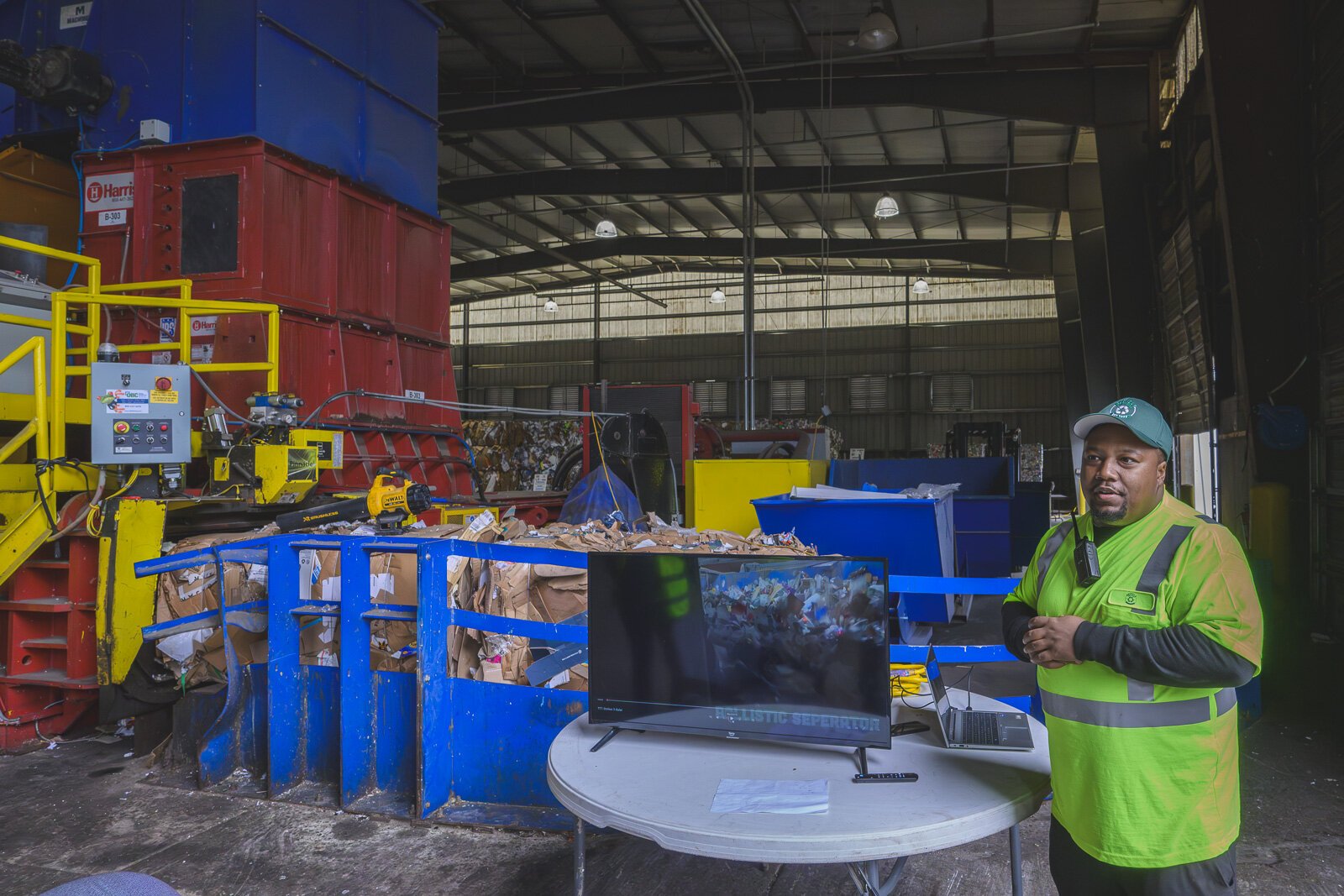 Oratarus Johnson explaining the sorting process at Ann Arbor's Material Recycling Facility.