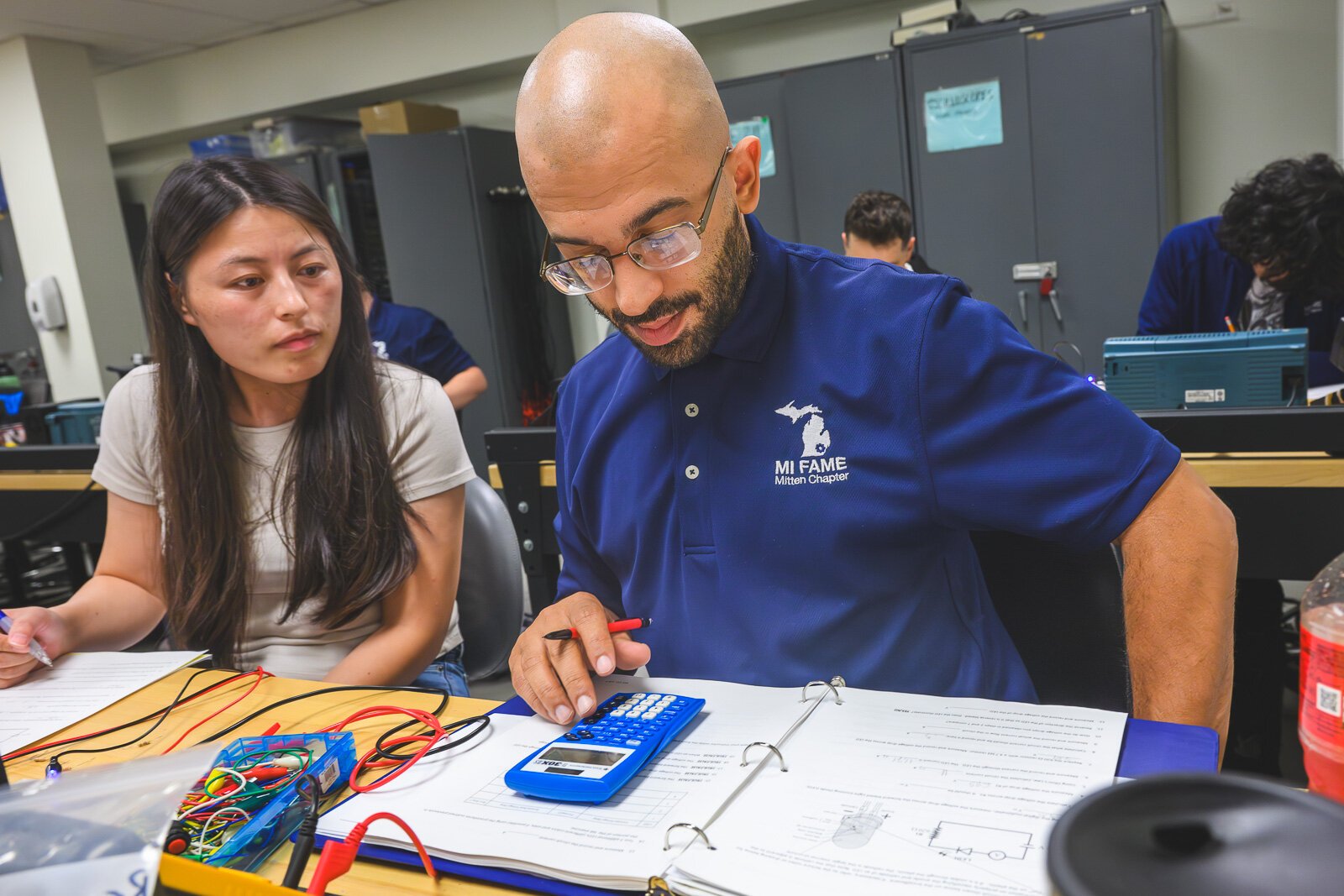 FAME program student Andrew Denton (right) and Hui Wu in Basic Electronics.
