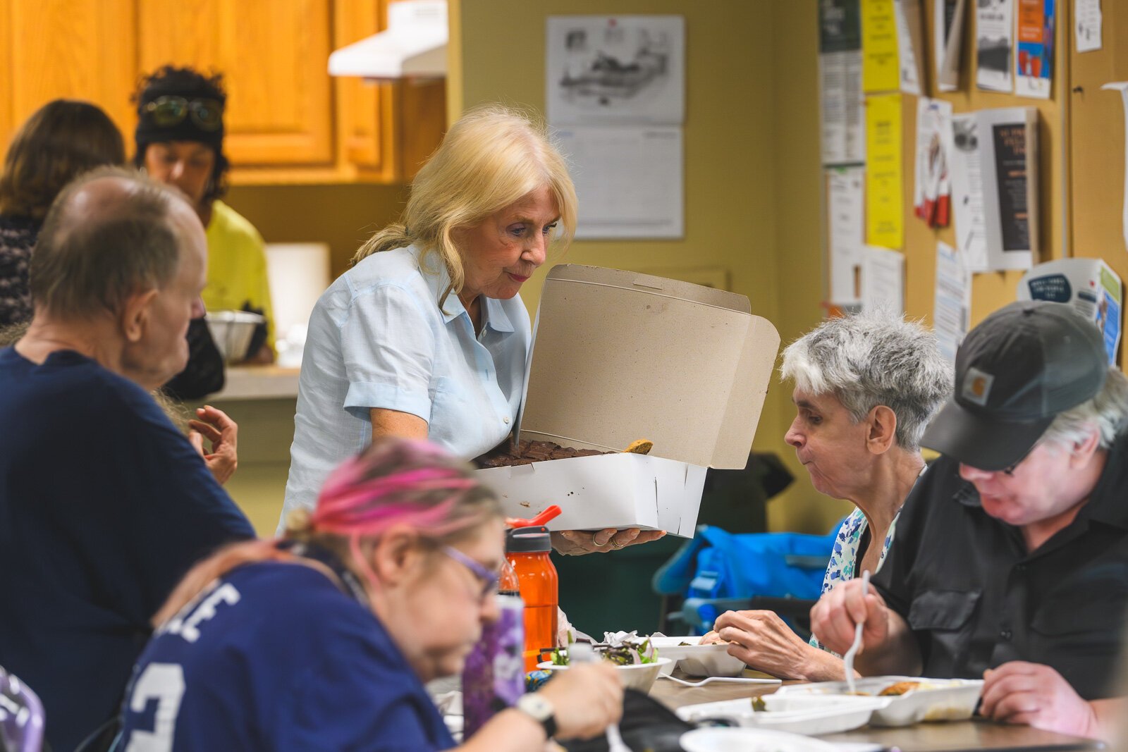 Linda French serving desserts at Chidester Place.