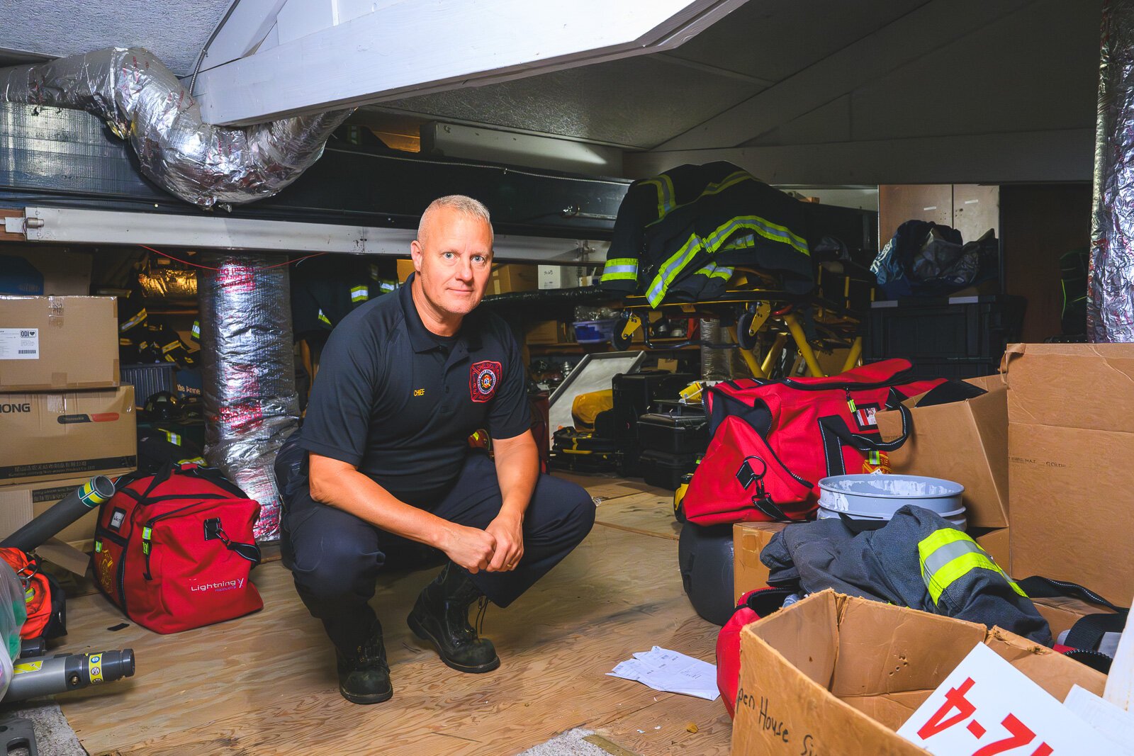 Chief Arbini in the upstairs storage space at the Chelsea fire station.
