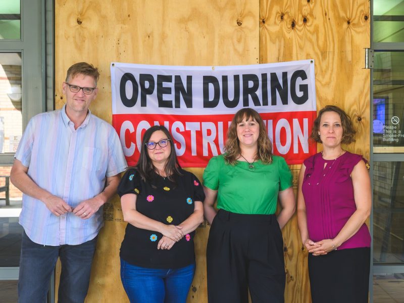 Matt Jones, Amber Davis, Brooke Boyst, and Alexis Braun Marks outside of Halle Library during the renovation.