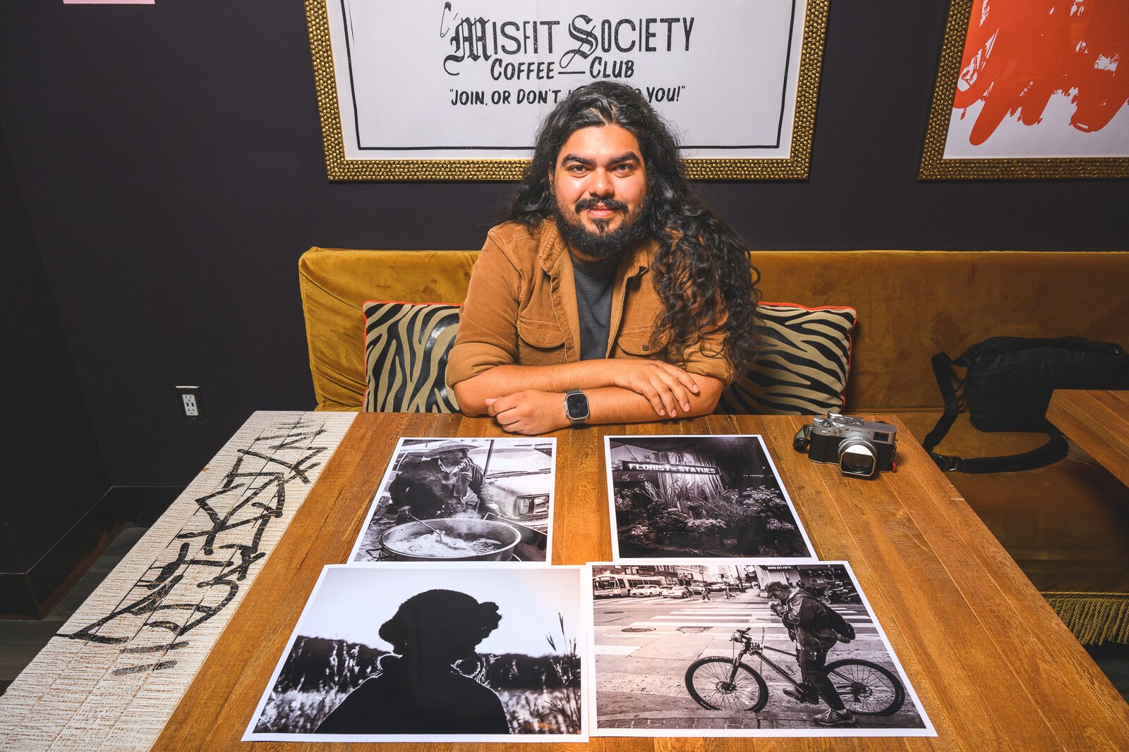 David Reyes with some prints of his photos.
