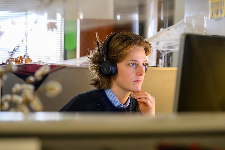 Washtenaw County Community Mental Health's Anika Sproull helps a caller.