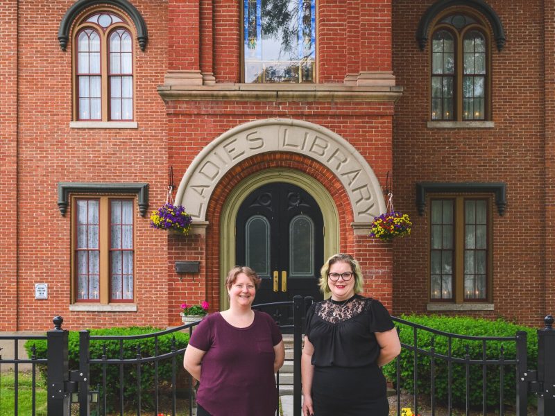 Crysta Coburn and Kay Gray at The Ladies Library building in Ypsilanti.