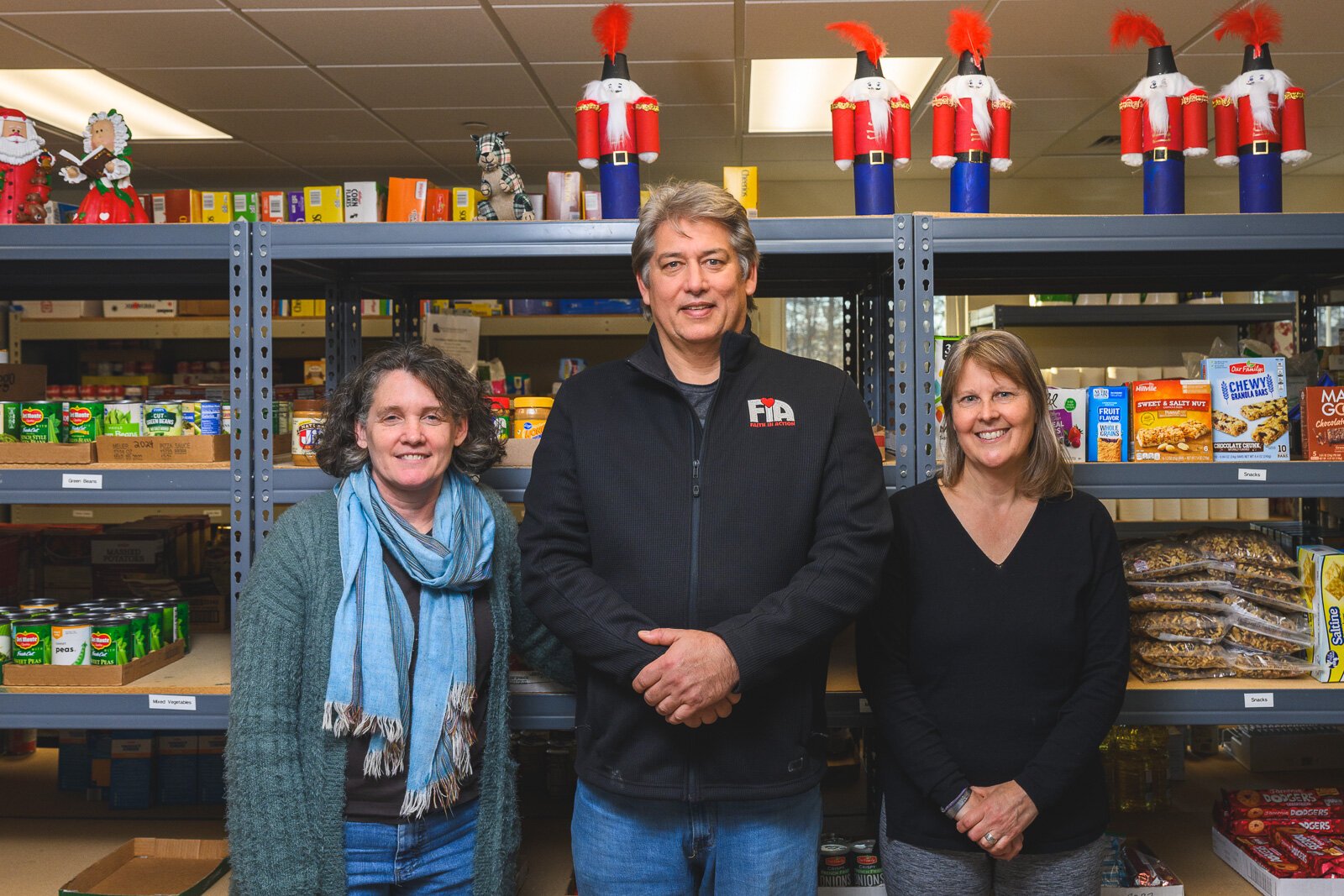 Wendy Carty-Saxon, Craig Rafail, and Sarah Shugart at the Hilltop View Apartments' food pantry.