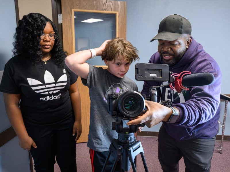 Keith Ragland (right) leading a podcasting workshop at Elevation Youth Corps with Elleona Ragland and Skyler Shaw-Hillman.