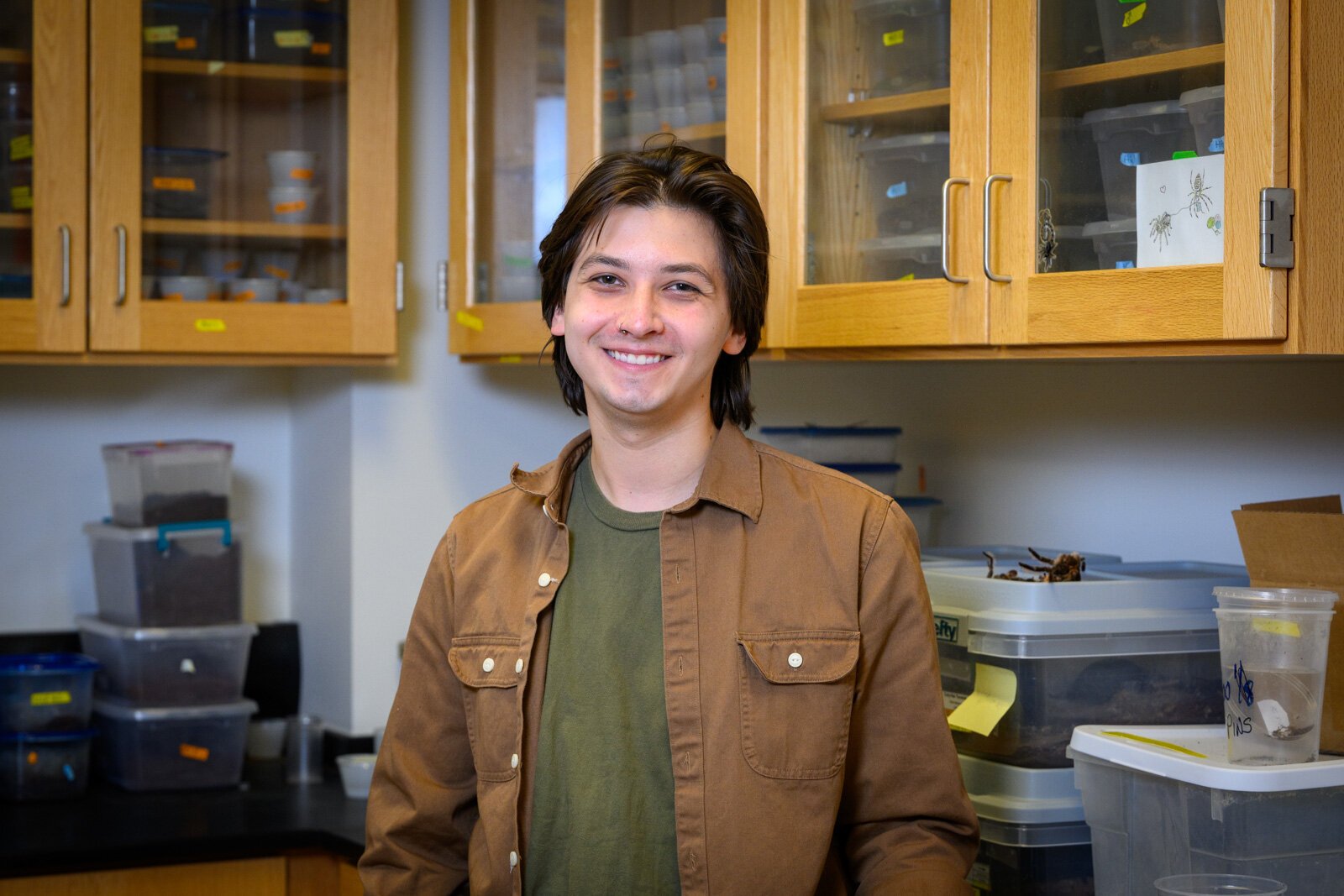 EMU graduate student Bradley Allendorfer at the EMU tarantula lab.