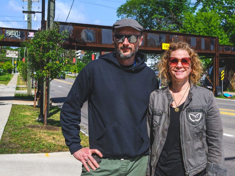 TreeTown Murals' Danijel Matanić and Mary Thiefels at the Huron Street bridge near North First Street.