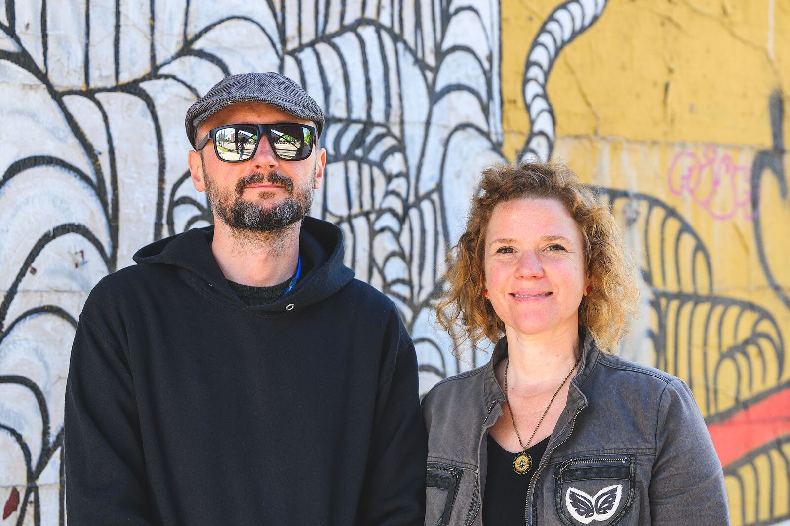TreeTown Murals' Danijel Matanic and Mary Thiefels at the Huron Street bridge near North First Street.
