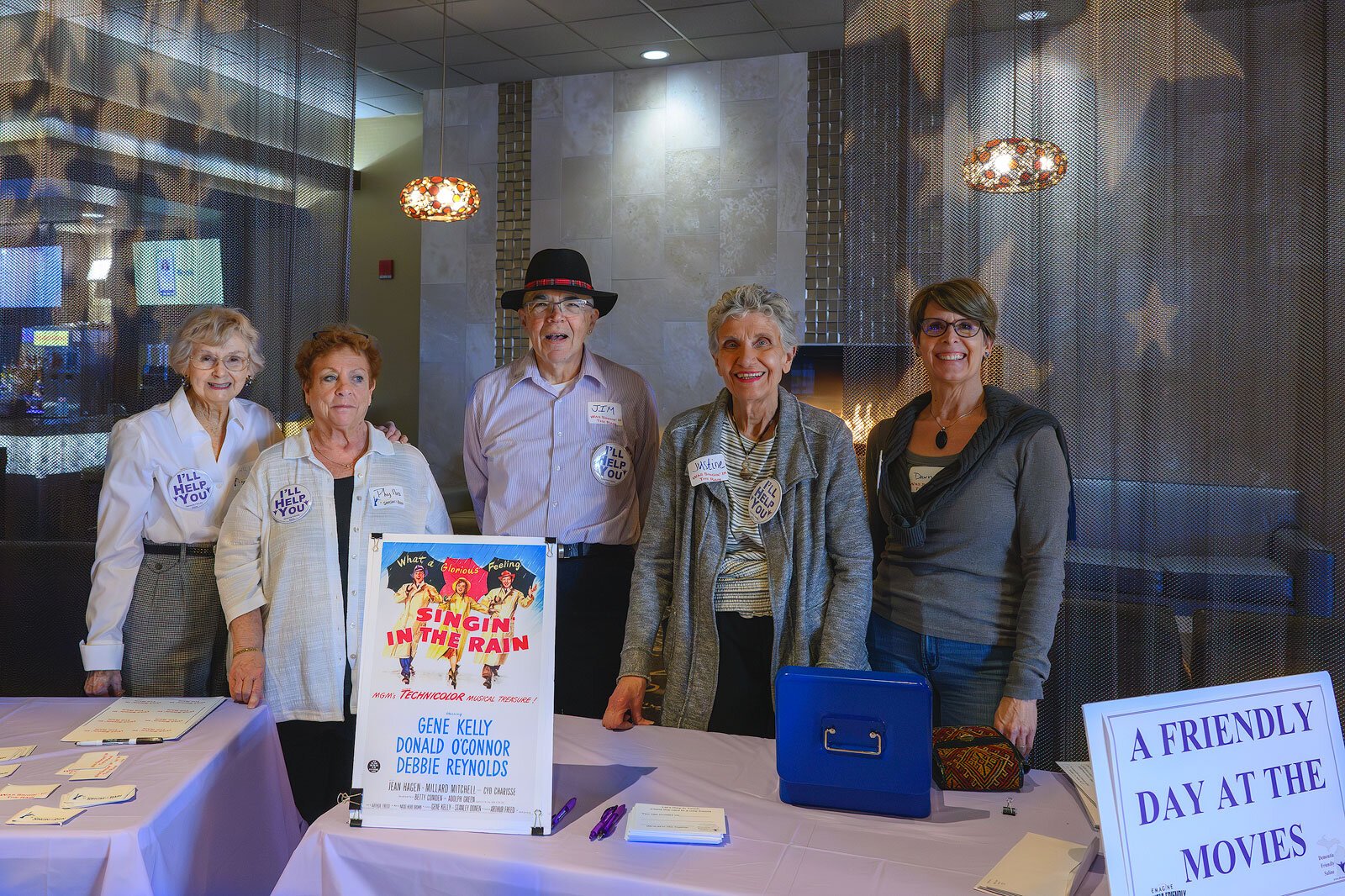 Jim Mangi (center) with volunteers at a dementia-friendly screening of "Singin' in the Rain" at Emagine Saline.
