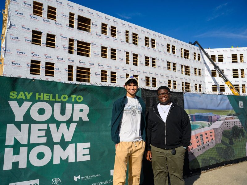 Auryon Azar and Cedrick Charles in front of the future New Lakeview Apartments at EMU.